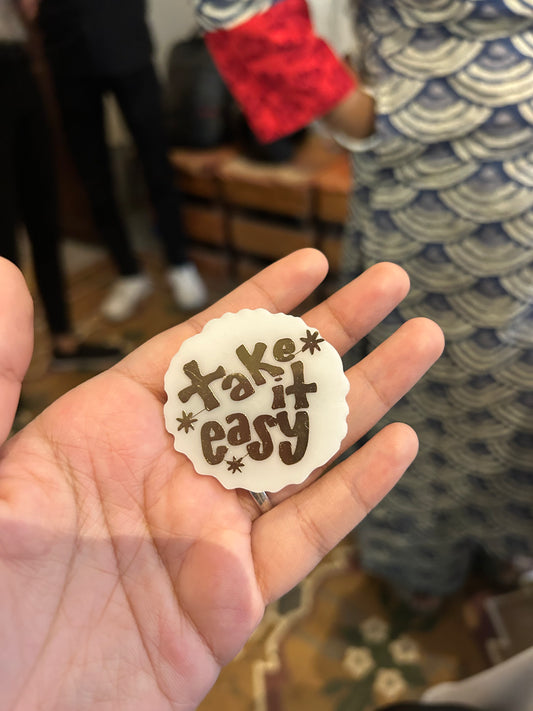 The "TAKE IT EASY" brooch