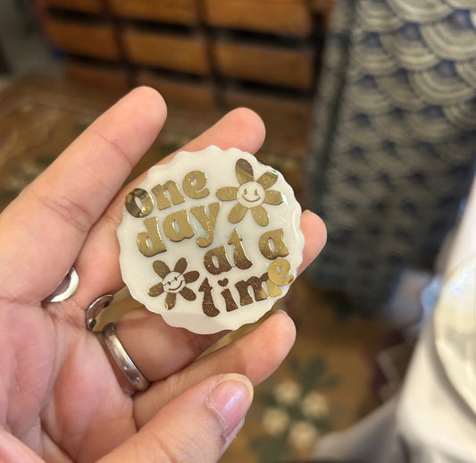 The "ONE DAY AT A TIME" brooch